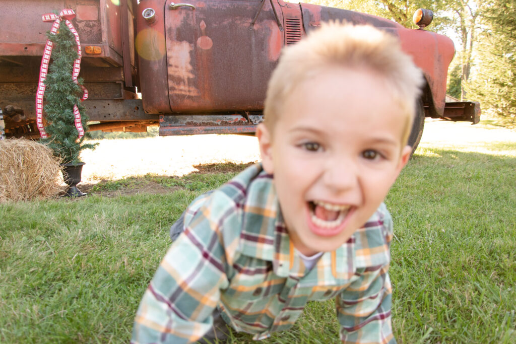 Crazy boy crawling towards camera.