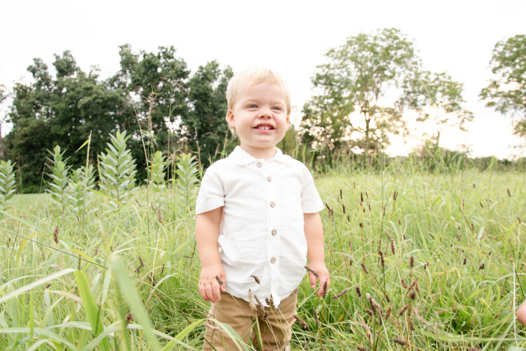 Boy looking at the camera and smiling.