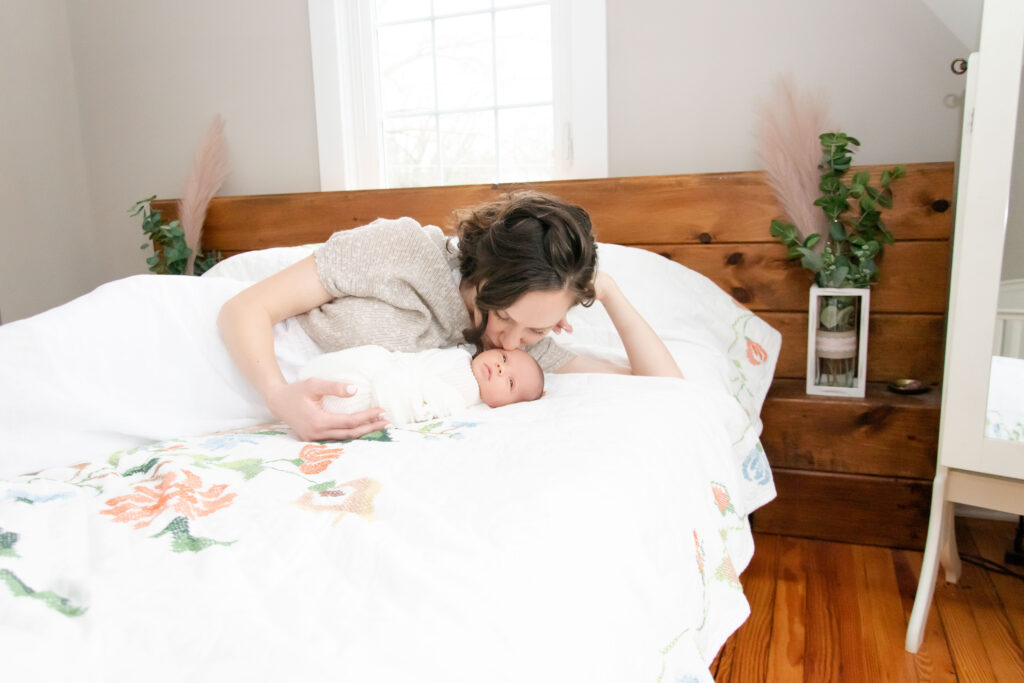 Mom Kissing her baby. A light and bright image