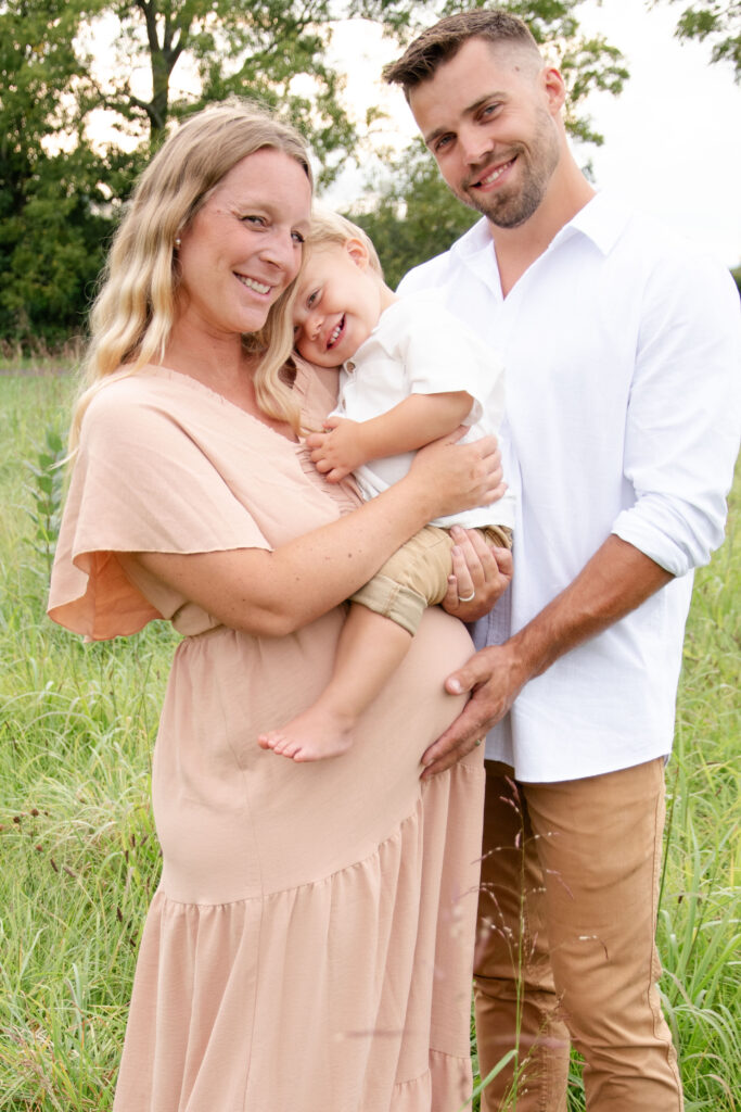 Family looking at camera smiling.