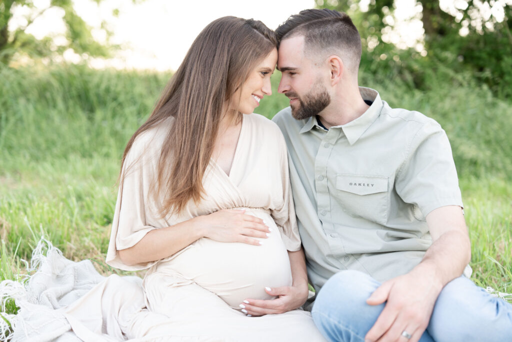 Digital Image of a husband and maternity mom in beige dress.