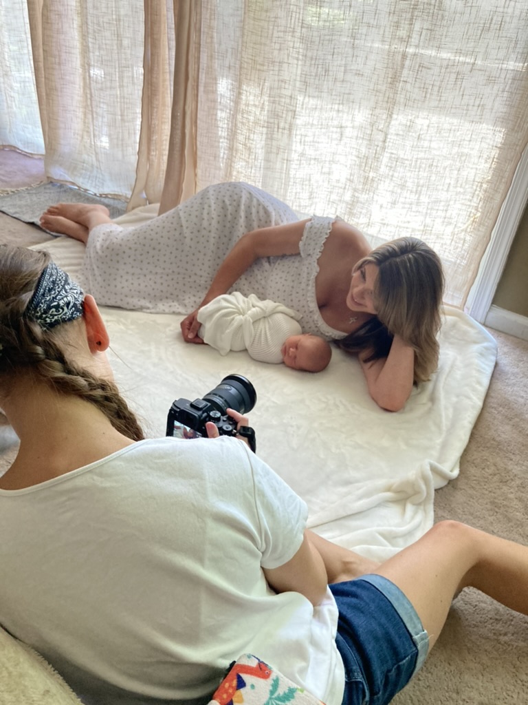 Graterford newborn photographer taking a picture of a mom and her newborn.