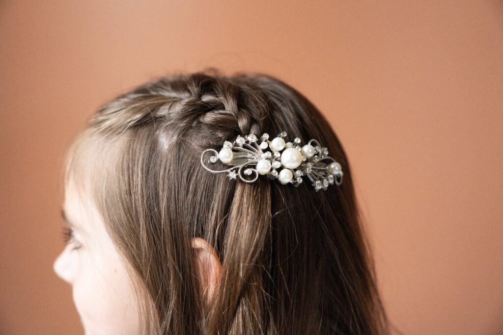 Girl with a pearl and silver clip.
