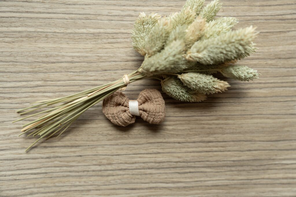 Bow clip next to wheat. 
